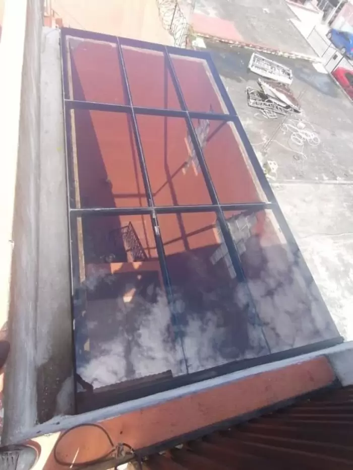 Q1,200 Construcciones | techo de vidrio laminado bronce,